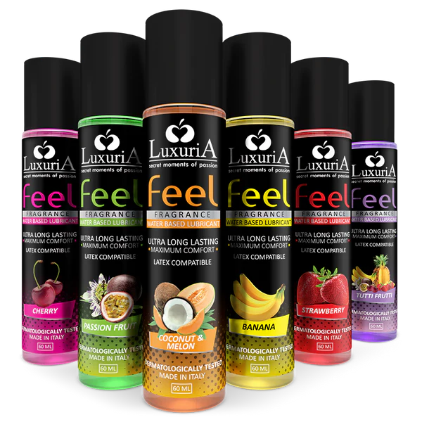 Linea lubrificanti Luxuria Feel: diverse fragranze in flaconi colorati su sfondo scuro